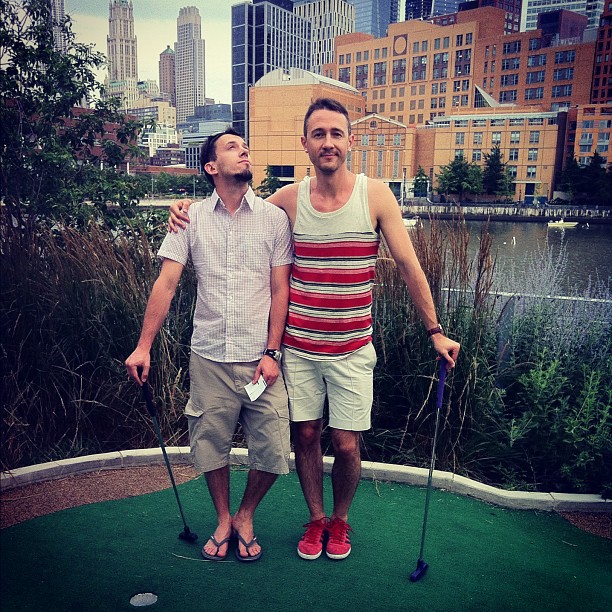 Just two guys playing silly mini golf