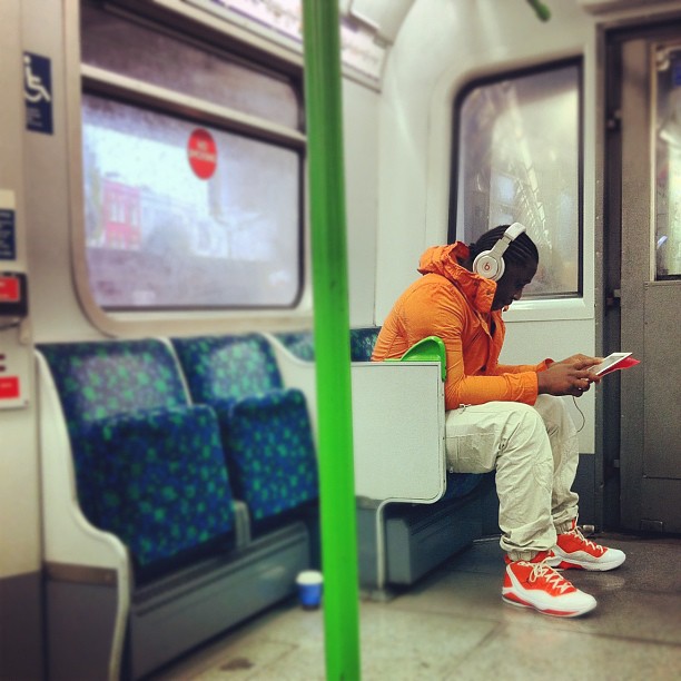 #people on #london #tube #underground #orange