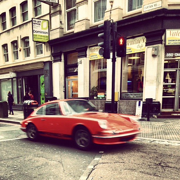 #orange #porsche on curtain  #road.#london #street #eastlondon #car #streetphoto