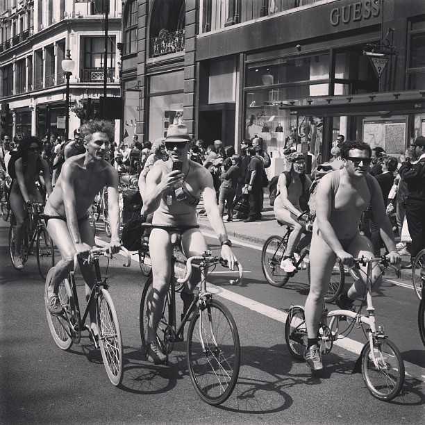 Three musketeers. Today I'm posting some images from London Naked Bike Ride. Check  skrinda.com for full story. #london #londonpop #london_only #ig_uk #ig_london #bnw_city #bnw_london #bw #bnw #blackandwhite #street #streetphoto #streetphotography #streetphotography_bw #bike #ride #nakedbikeride #igerslondon #igers_london #bnwlife #bnw_life
