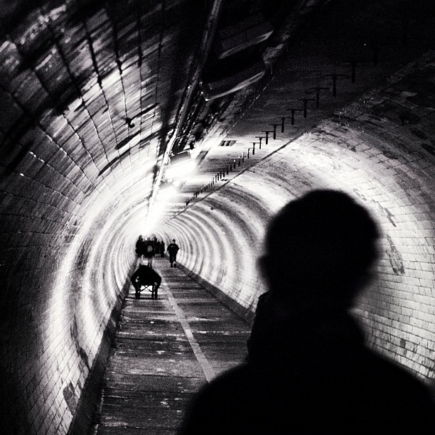 The lives of others. #london #londonpop #london_only #ig_uk #ig_london #bnw_city #bnw_london #bw #bnw #blackandwhite #street #streetphoto #streetphotography #streetphotography_bw #igerslondon #igers_london #streetshot_london #tunnel